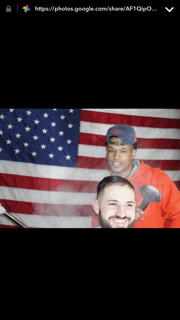 Rommell with satisfied client and American flag