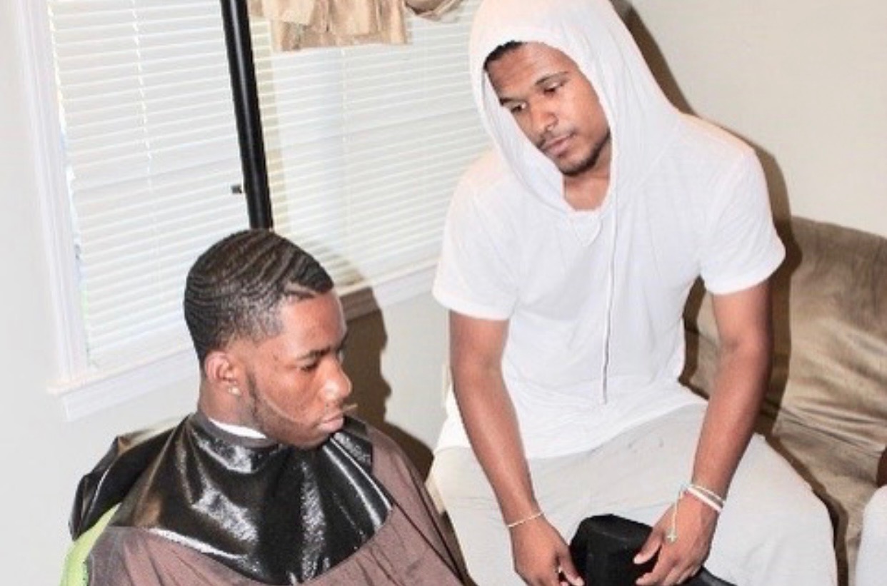 Rommell with client during haircut